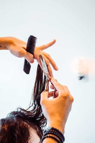 Cutting Hair in a Sola Salon Suite - Occipital Salon Marketing